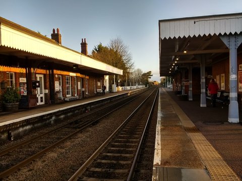 Wymondham Norfolk East Anglia England - December Sunday 8th 2019: Wymondham's beautiful original antique vintage railway station buildings, rail track Winter day sunshine prior to redevelopment area