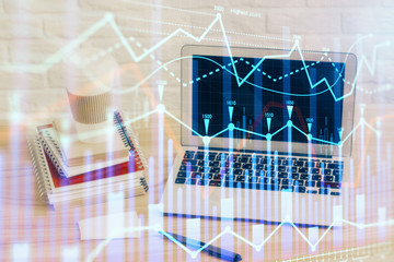 Stock market graph and table with computer background. Multi exposure. Concept of financial analysis.