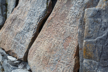 Buddhist mani stones in Nepal. Close-up.	