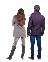 Back view of couple in winter jacket. beautiful friendly girl and guy together.