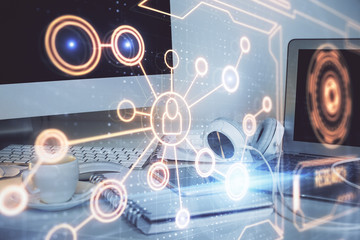 Computer on desktop with social network theme icon. Multi exposure. Concept of international connections.