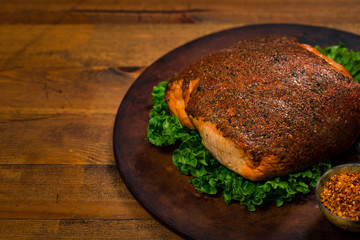 Roasted Turkey Breast Cajun Style Deli Lunch Meat on Old Wooden Background. Selective focus.