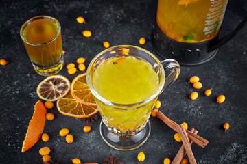 Sea buckthorn tea on a dark background