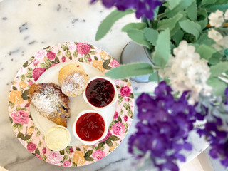 scones with jam and cream,tea break time with dessert on marble table