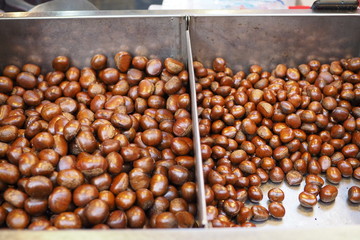 chestnuts roasted from a street vendor on the road in winter