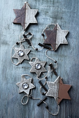 Wooden Christmas Ornaments on rustic background. Top view. 