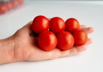 red cherry tomatoes on a white background