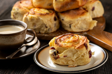 Homemade sweet bread buns with cottage cheese and cranberries filling.