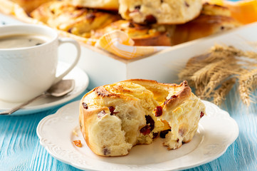 Homemade sweet bread buns with cottage cheese and cranberries filling.