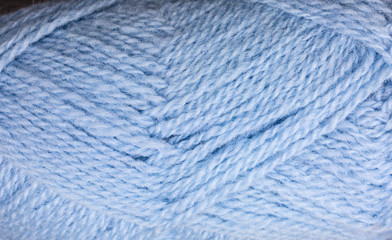 background of ball of shetland wool in pastel blue