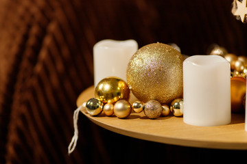 Obraz na płótnie Canvas Golden Christmas Balls From A Christmas Tree Branch
