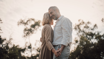 Older Lover and dating concept.Beautiful Senior couple romantic dancing in park.mature couple in...