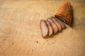 raw smoked horse meat Basturma traditional Armenian cuisine tasty dish wooden cutting board background textured surface concept food photography, copy space 