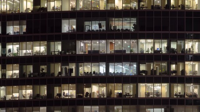 Close view to office windows in Skyscrapers International Business Center City at night timelapse from top, Moscow, Russia. Tilt down and up loop