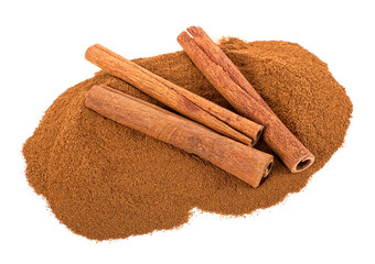 Three cinnamon sticks and powder isolated on a white background