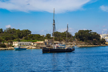 Fototapeta na wymiar Sailing boat in Marsamxett Harbour, Malta