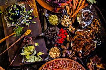 Top view Thai spices and herbs ingredient decoration on wood table for cook in home kitchen. 