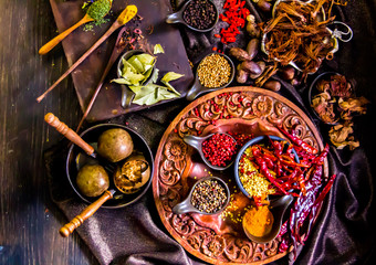 Top view Thai spices and herbs ingredient decoration on wood table for cook in home kitchen. 