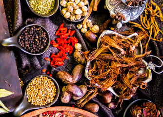 Top view Thai spices and herbs ingredient decoration on wood table for cook in home kitchen. 