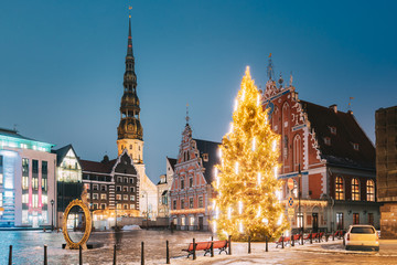 Riga, Latvia. Town Hall Square, Popular Place With Famous Landmarks On It In Bright Evening Illumination In Winter Twilight. Winter New Year Christmas Holiday Season - obrazy, fototapety, plakaty