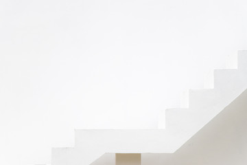 Obraz premium White staircase on concrete wall background (Concept for career path, target aiming, aspiration)