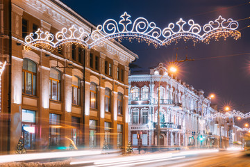 Fototapeta na wymiar Gomel, Belarus. Festive Street Illumination On Central Street In Gomel. New Year Celebration In Belarus
