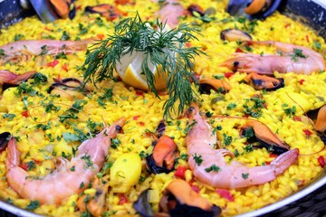 Pot with yellow rice and sea food