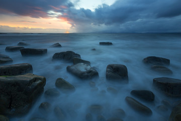Naklejka premium Sunset on a typical Irish seascape