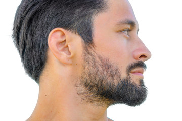 Obraz premium Close up profile portrait of healthy man with black hair, strong features, looking straight ahead