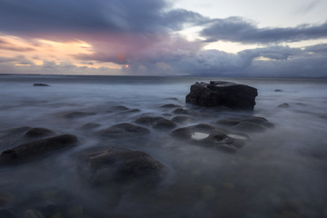 Fototapeta na wymiar Sunset over the sea and rocks in Ireland