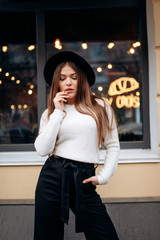 Young stylish woman in a city street