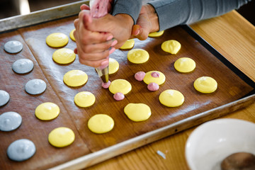 French macaroon cooking master class in a kitchen with various people and different angles in Eastern European Baltic Riga Latvia