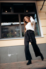 Young stylish woman in a city street