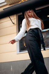 Young stylish woman in a city street