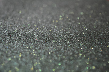 Beautiful Abstract Sparkle Glitter Lights Background. Deep Green Dark Emerald. Shine Bokeh Effect. For party, holidays, celebration. Good for New Year and Christmas Card