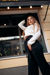 Young stylish woman in a city street