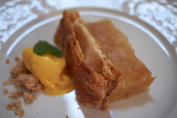 Apple cake with ice cream and amaretto