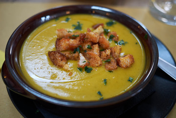 Pumpkin soup with croutons and parsley