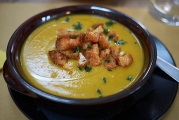 Pumpkin soup with croutons and parsley