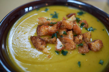 Pumpkin soup with croutons and parsley