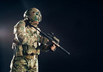portrait of adult carrying out military service, soldier man with rifle, fearless male in military...