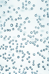 Fototapeta na wymiar Close-up shot of sparkling wine bubbles background pattern.