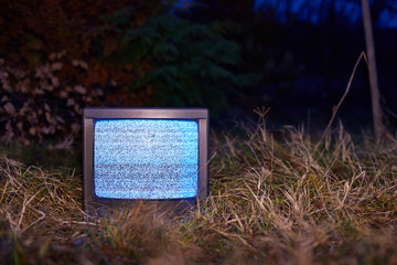 White noise on an analogue TV set in outdoor environment