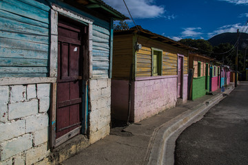 Fototapeta na wymiar dramatic image of clourful homes on a dominican republic mountain town in the caribbean