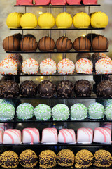 Pyramid of colorful various desserts. Sweets on the holiday. Edible decoration for events or weddings