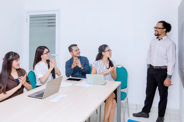 Business people clapping for successful business