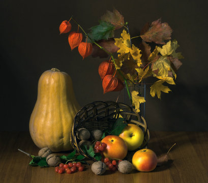 still life of pumpkins and apples