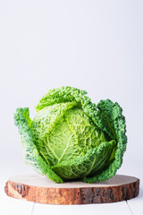 fresh organic cabbage headsin a straw hat. Antioxidant balanced diet eating, creative food, peganism