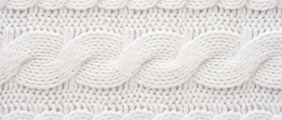 White Knit Fabric Background. Wool Sweater Texture Close Up