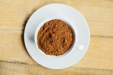 Top view of a cup filled with coffee powders